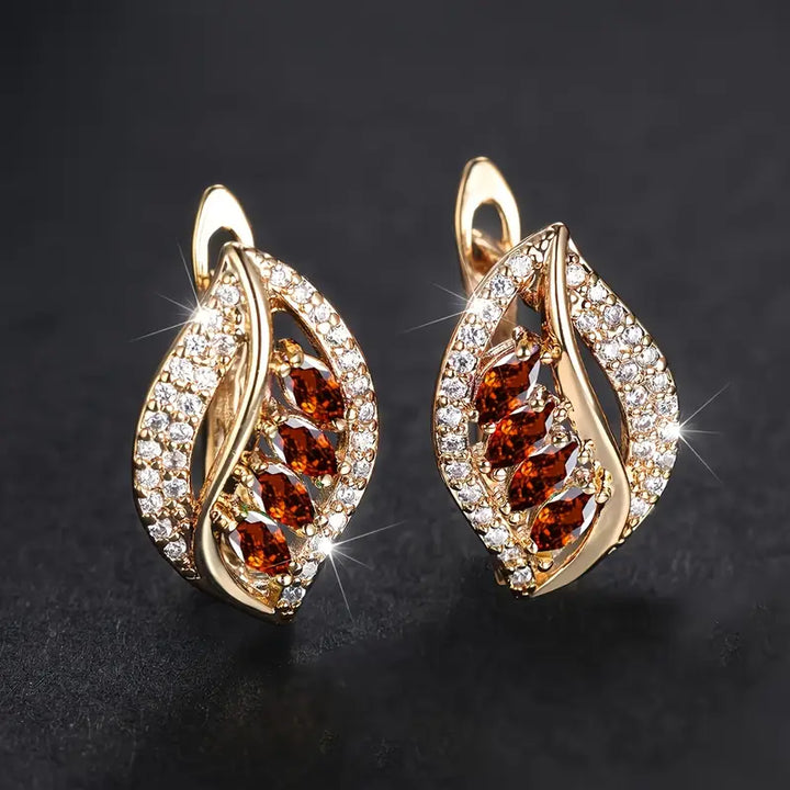 Soft gold earrings with a rosé shine