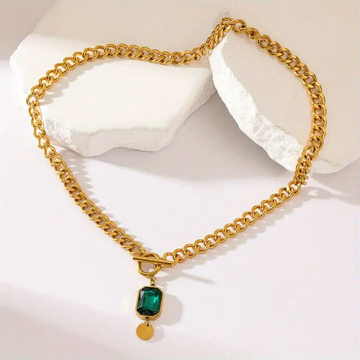 Elegant gold necklace with emerald pendant