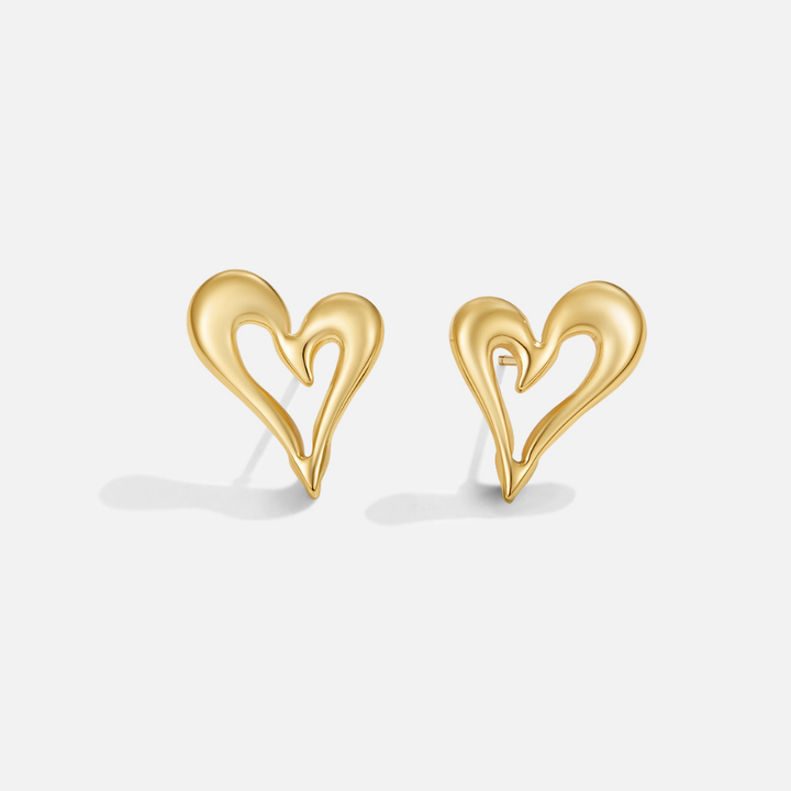 Elegant gold earrings with little heart