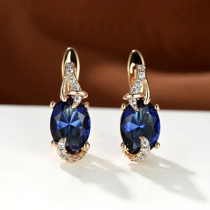 Elegant gold earrings with a refined hanging link