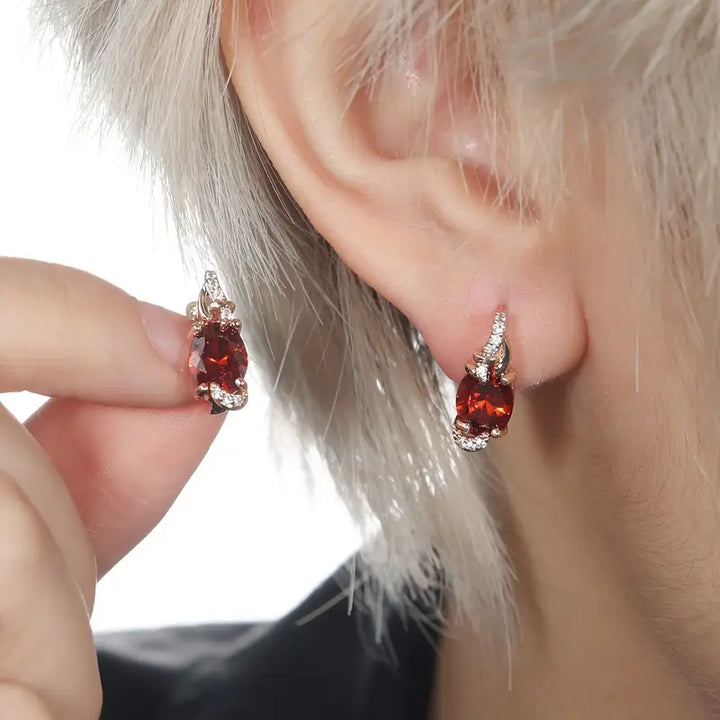 Elegant gold earrings with crimson pendants