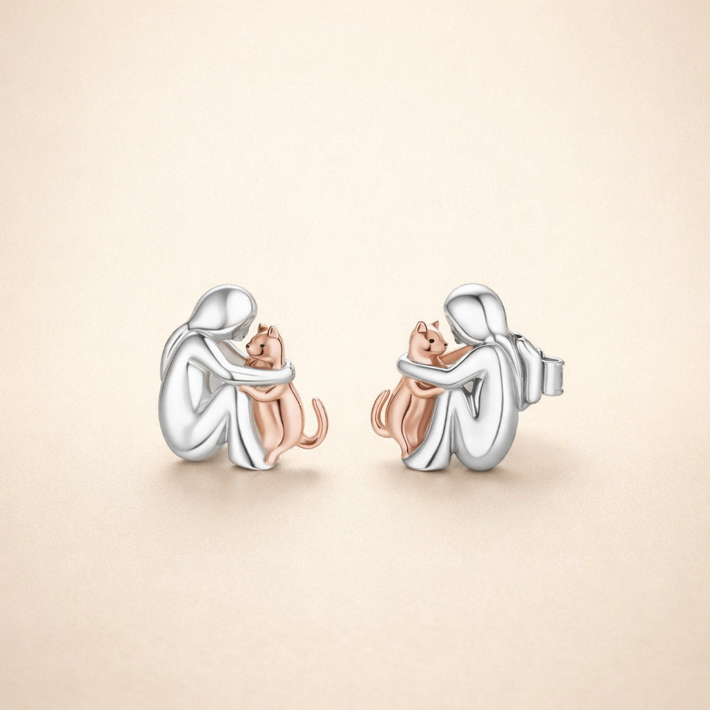 Soft gold earrings with a delicate flower
