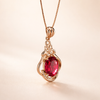 Elegant gold necklace with red crystal accents
