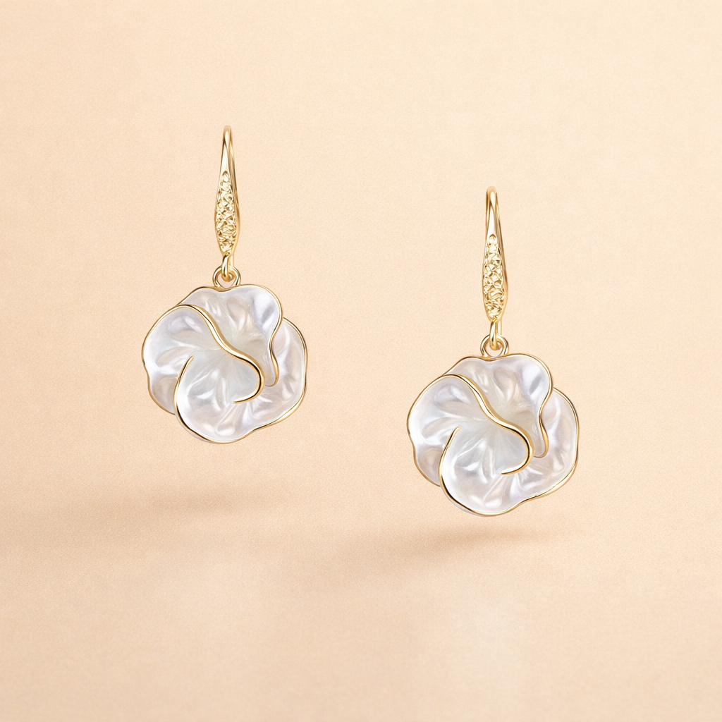 Elegant gold earrings with white spiral shape