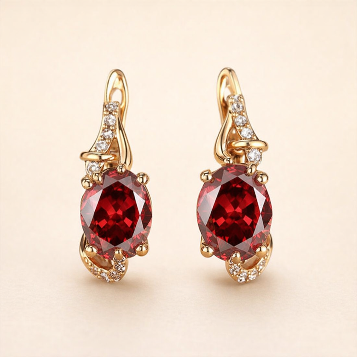 Elegant gold earrings with crimson pendants