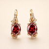 Elegant gold earrings with crimson pendants