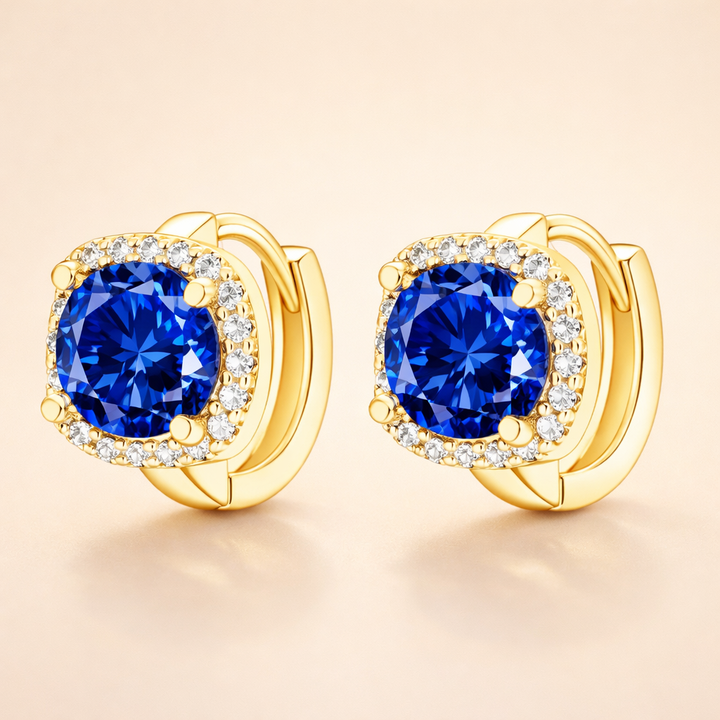 Soft gold earrings with sapphire detail