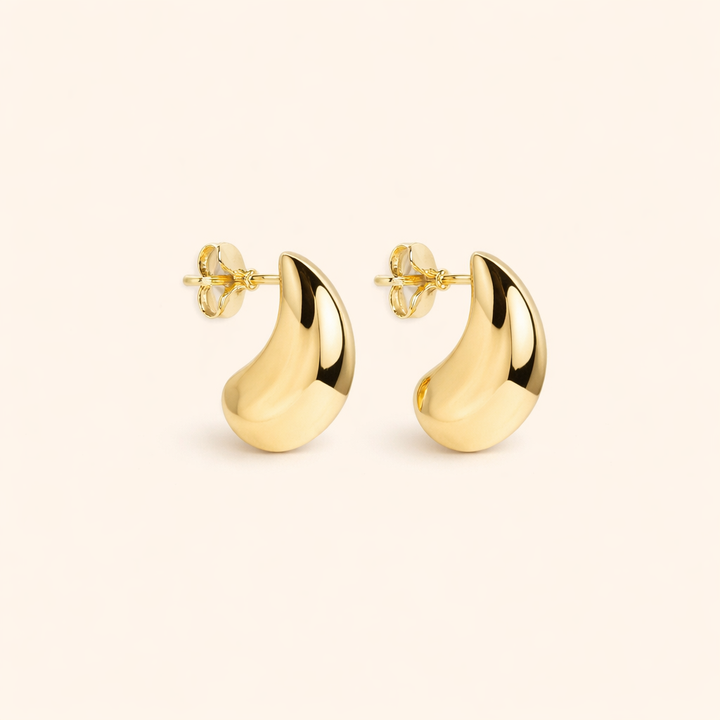 Elegant white gold earrings with subtle dangling elements