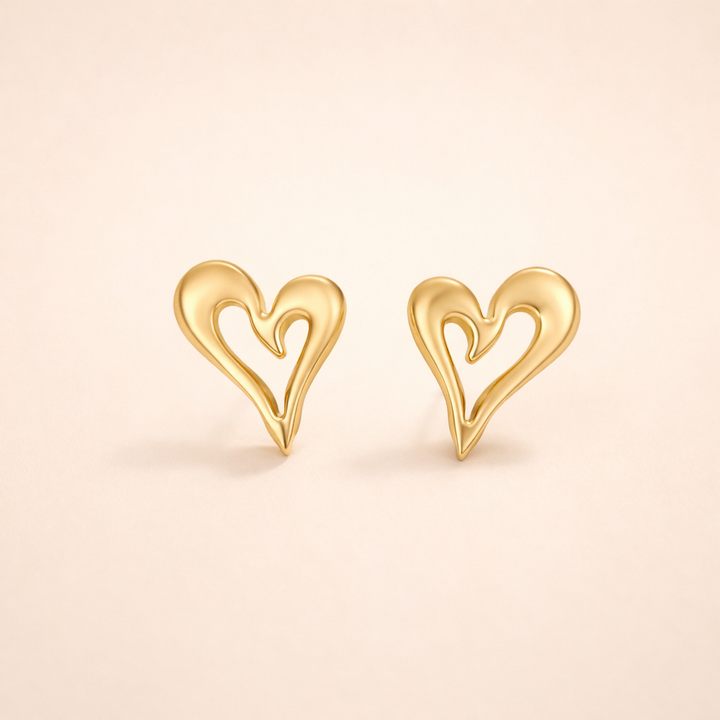 Elegant gold earrings with little heart