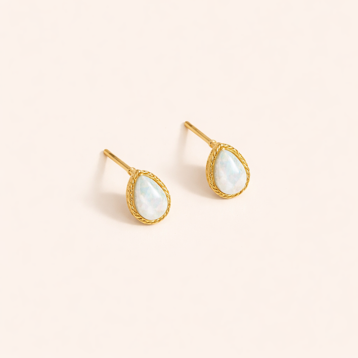 Elegant gold earrings with drop-shaped opal stones