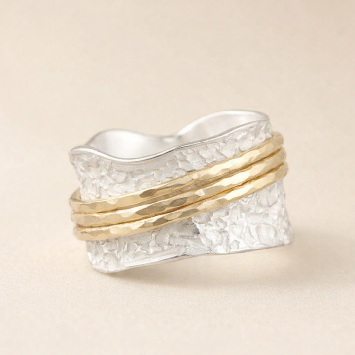 Elegant thin gold and silver ring with refined design