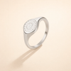 Silver ring with sunburst motif