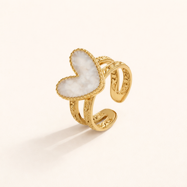 Simple gold ring with little heart