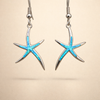 Silver earrings with opal and starfish design