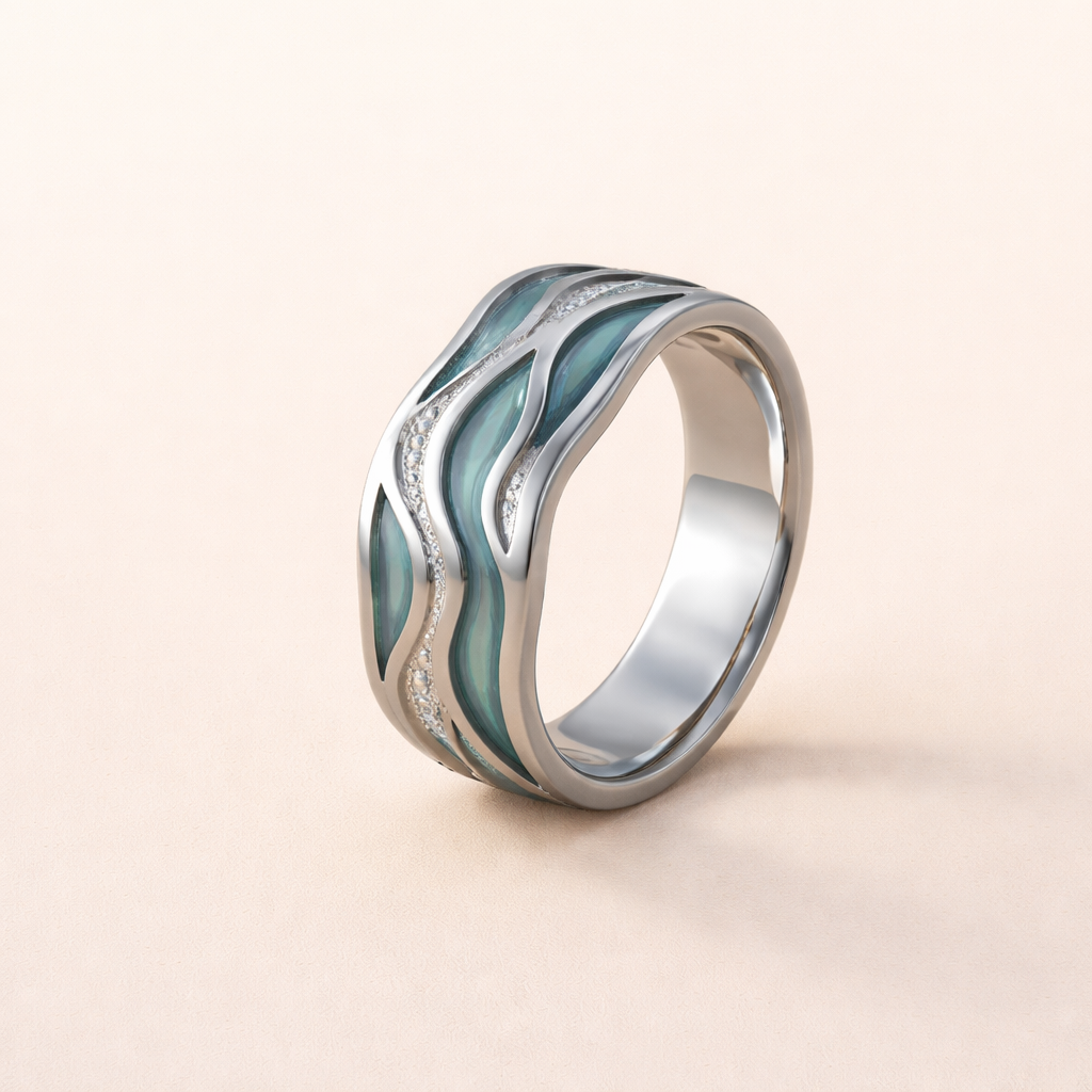 Silver ring with wave design and turquoise accents