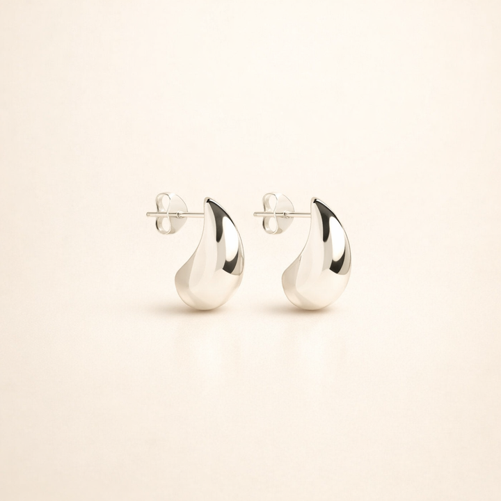Elegant white gold earrings with subtle dangling elements