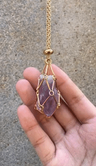 Necklace with interchangeable crystal stone for radiant style and harmony.