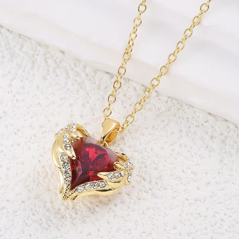 Soft Embrace gold necklace with ruby heart
