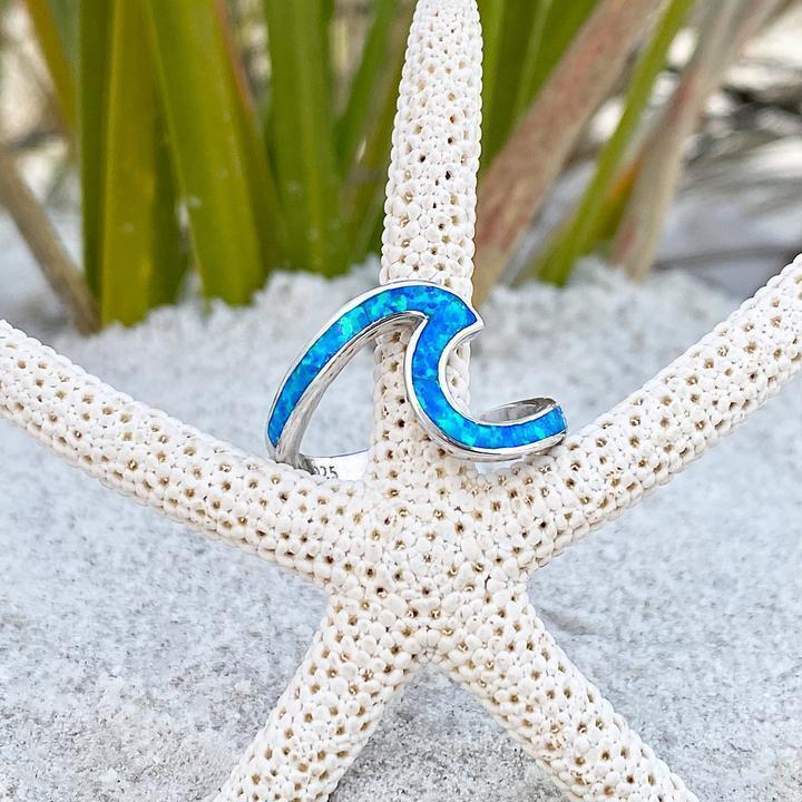 Silver ring with opal and wavy shapes