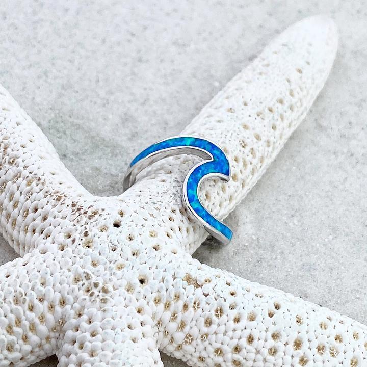 Silver ring with opal and wavy shapes