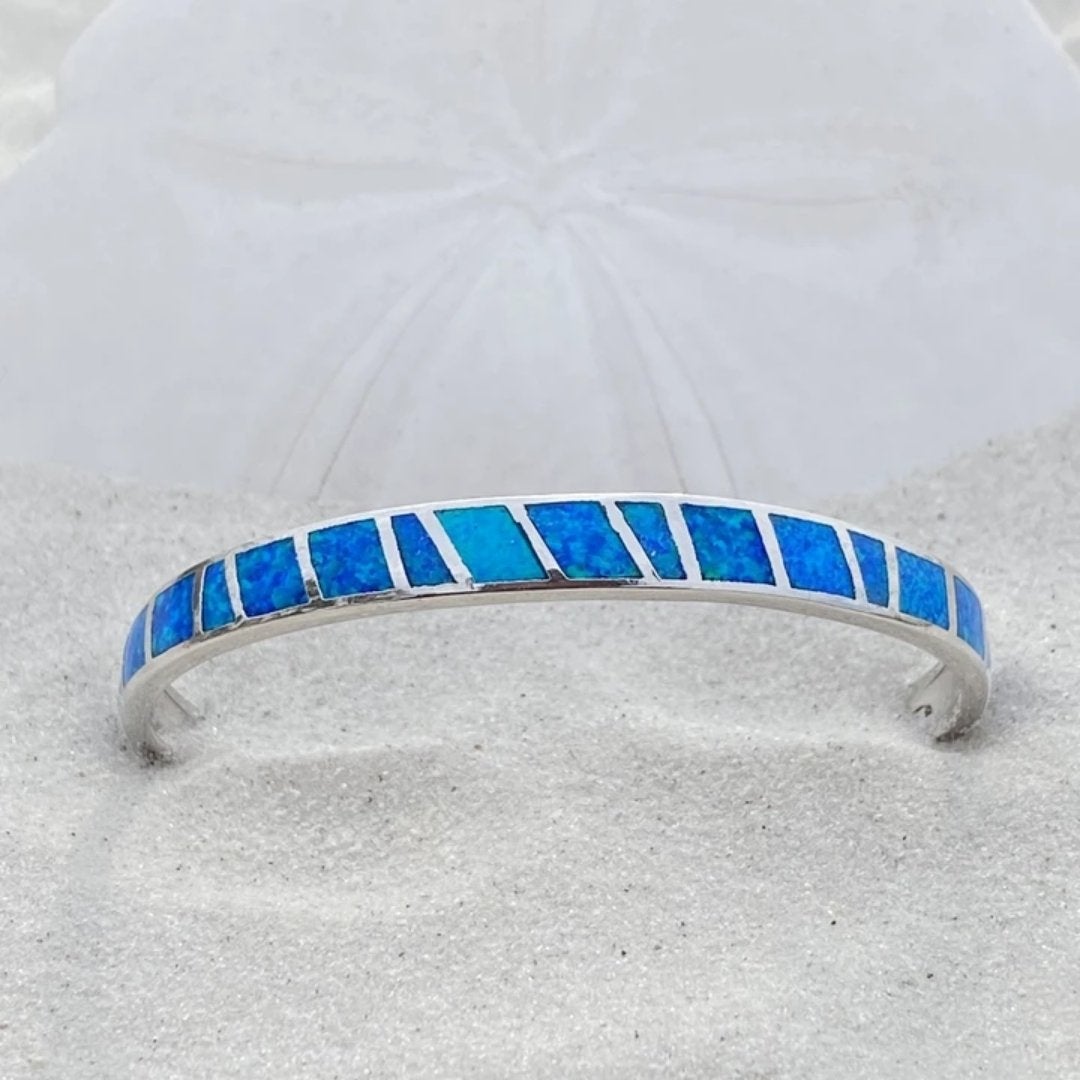Silver bracelet with blue opal and refined details
