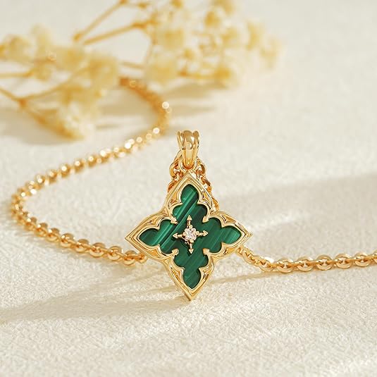 Gold necklace with four-leaf clover