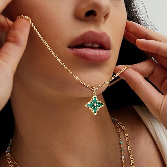 Gold necklace with four-leaf clover