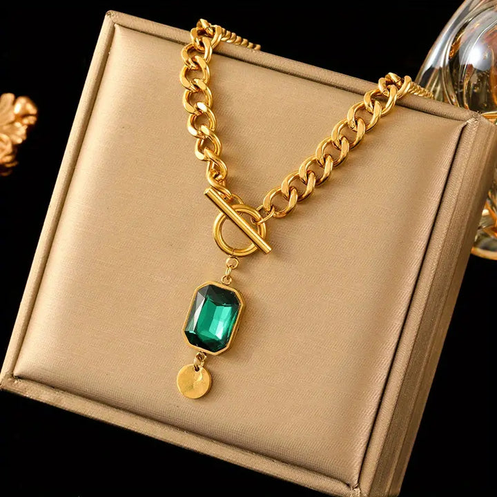 Elegant gold necklace with emerald pendant