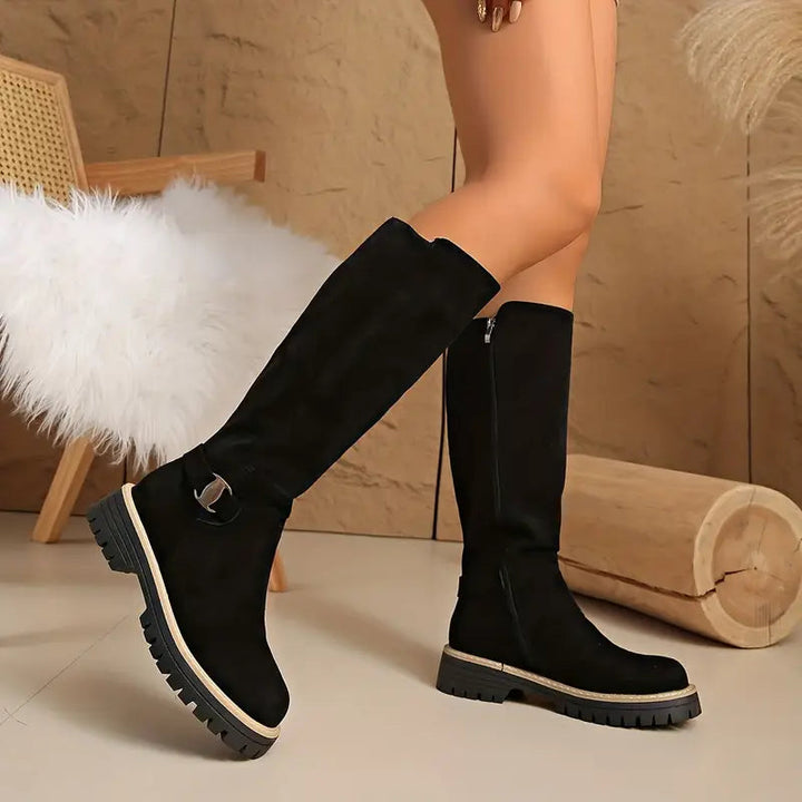 High boots with a thick, non-slip sole.