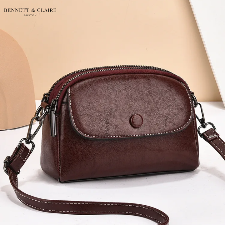 Cross-body bag with multiple pockets and adjustable strap