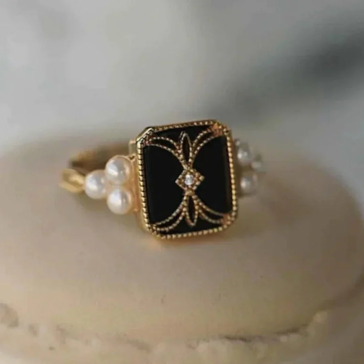 Elegant gold ring with antique black pearl