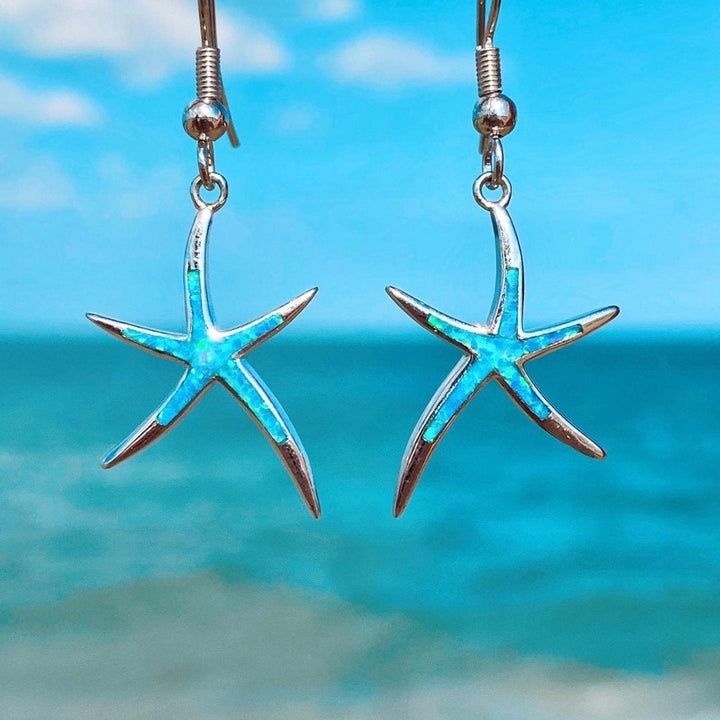 Silver earrings with opal and starfish design