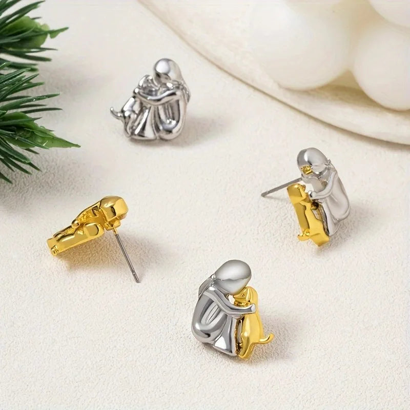 Minimalist silver earrings with subtle round shapes