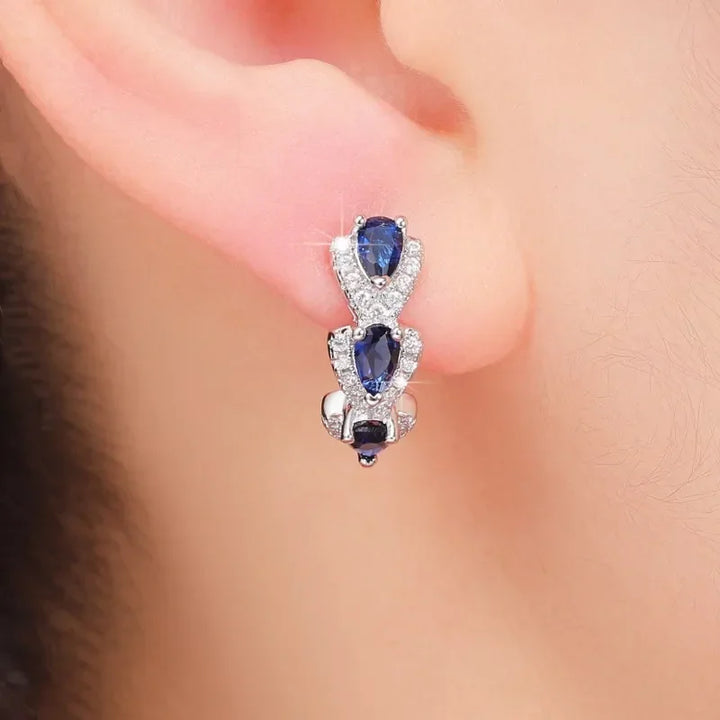 Elegant white gold earrings with sapphire accents