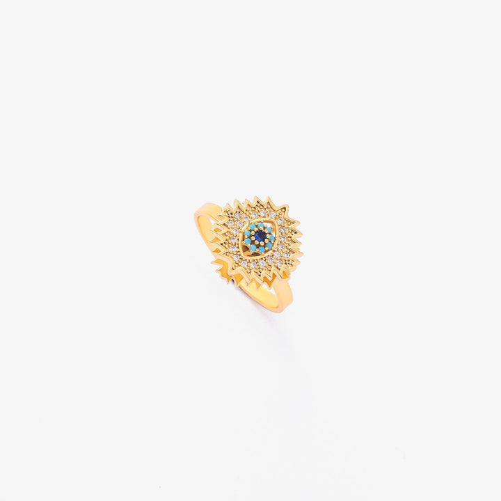 Gold twist ring with sapphire and sunburst design