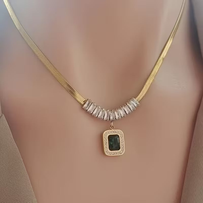 Elegant Gold Pendant with Emerald Prism