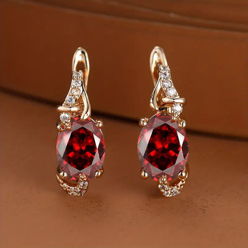 Elegant gold earrings with crimson pendants