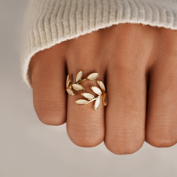 Serene gold ring with delicate little leaves
