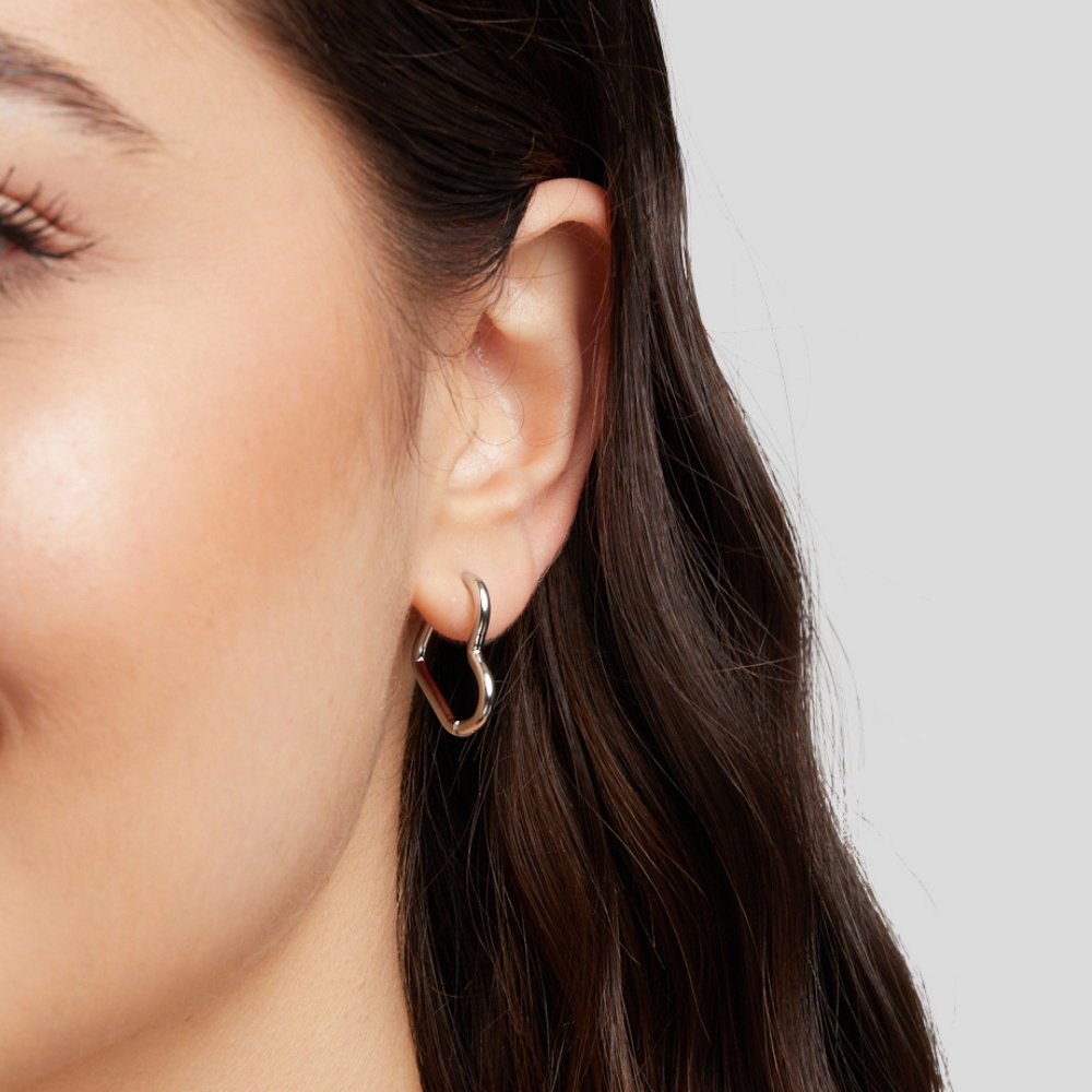 Elegant silver earrings with heart-shaped details
