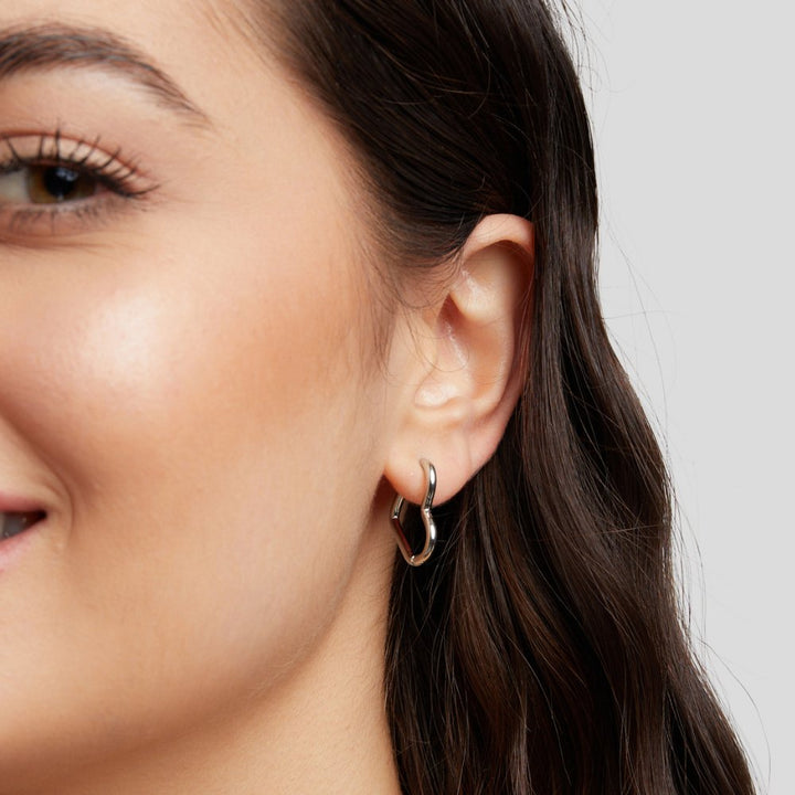 Elegant silver earrings with heart-shaped details