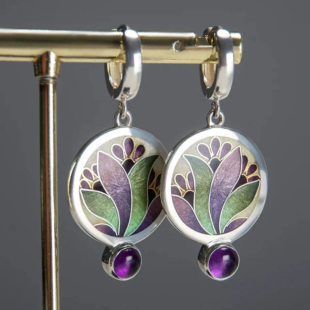 Elegant white gold earrings with purple crystals