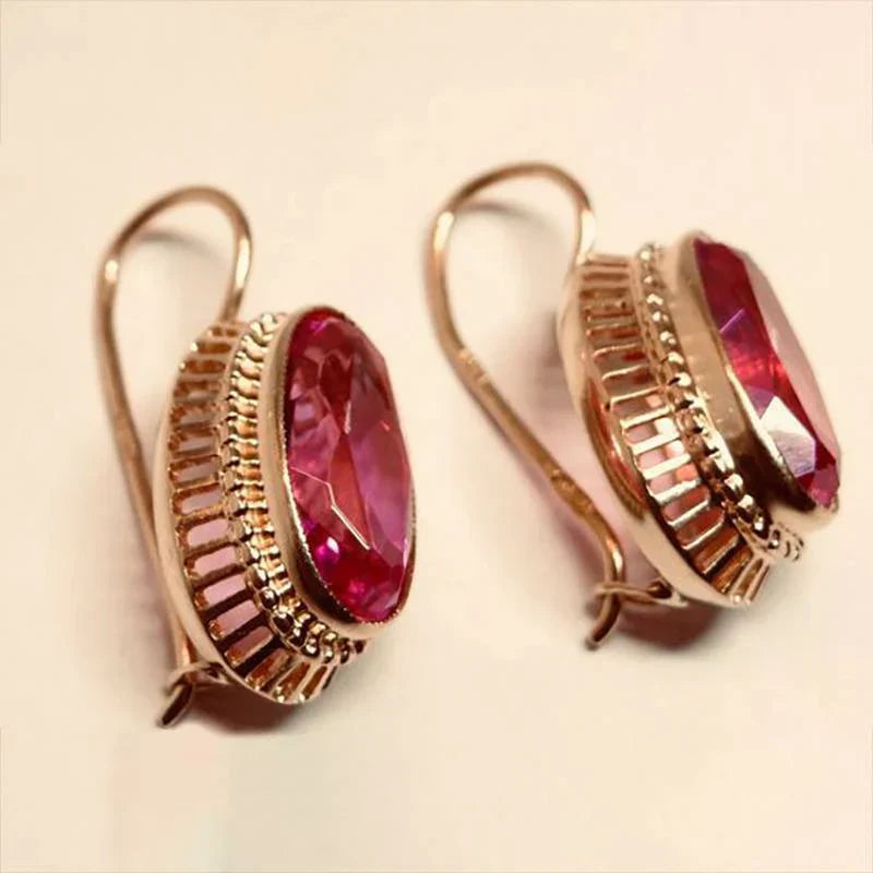 Elegant gold earrings with black stone