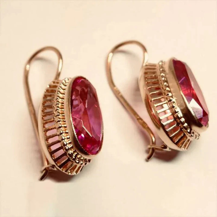 Elegant gold earrings with black stone