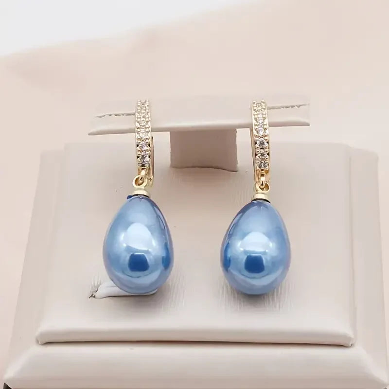 Soft Waves gold-coloured earrings with blue cubic zirconia