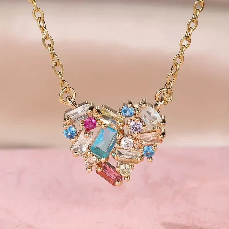 Elegant gold necklace with colourful little heart