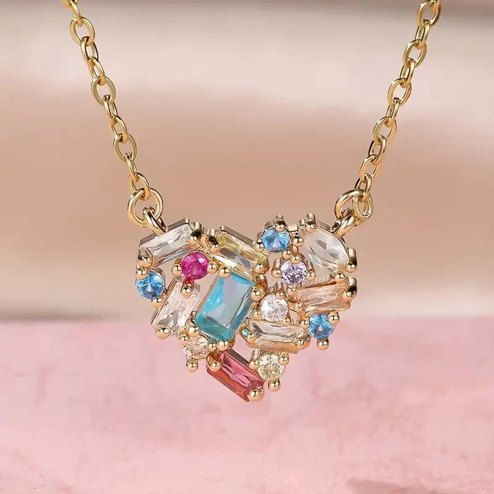 Elegant gold necklace with colourful little heart