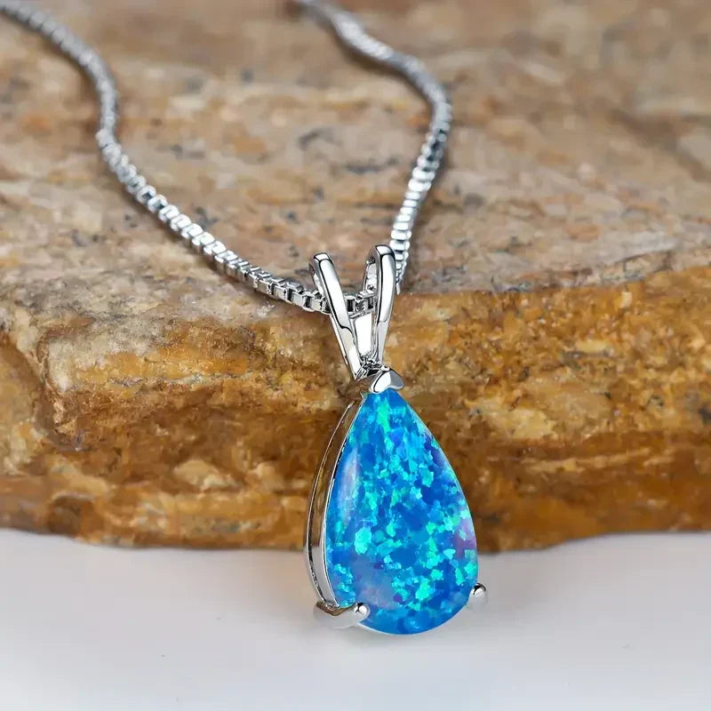 Soft white gold drop necklace with opal accent