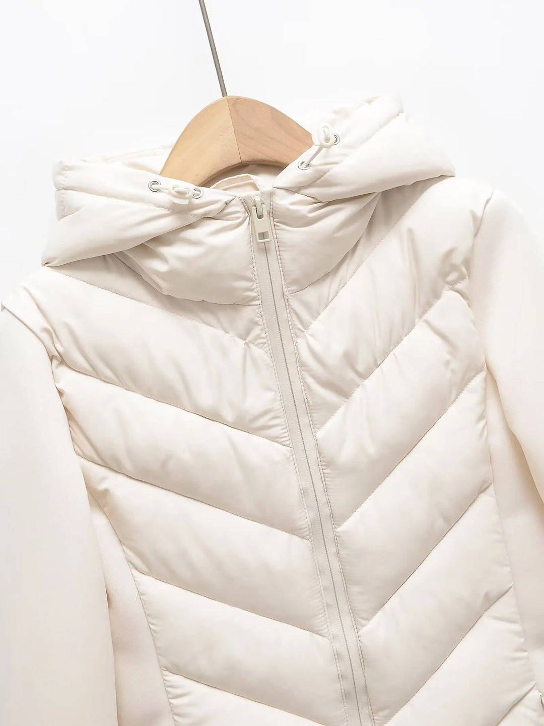 Lightweight Women's Quilted Winter Jacket with Hood and Hidden Pockets.