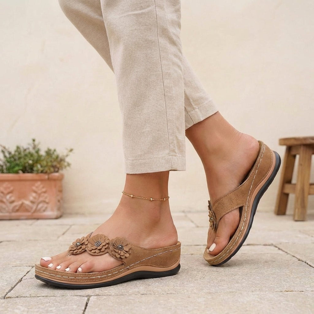 https://cdn.shopify.com/s/files/1/0878/4406/1529/files/orthopedic-flip-flops-floral-wedge-heel-comfort-sandals-2.jpg?v=1777503896