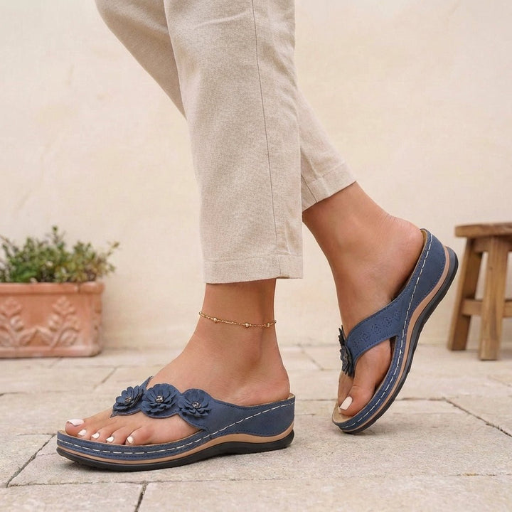 https://cdn.shopify.com/s/files/1/0878/4406/1529/files/orthopedic-flip-flops-floral-wedge-heel-comfort-sandals-4.jpg?v=1777503896